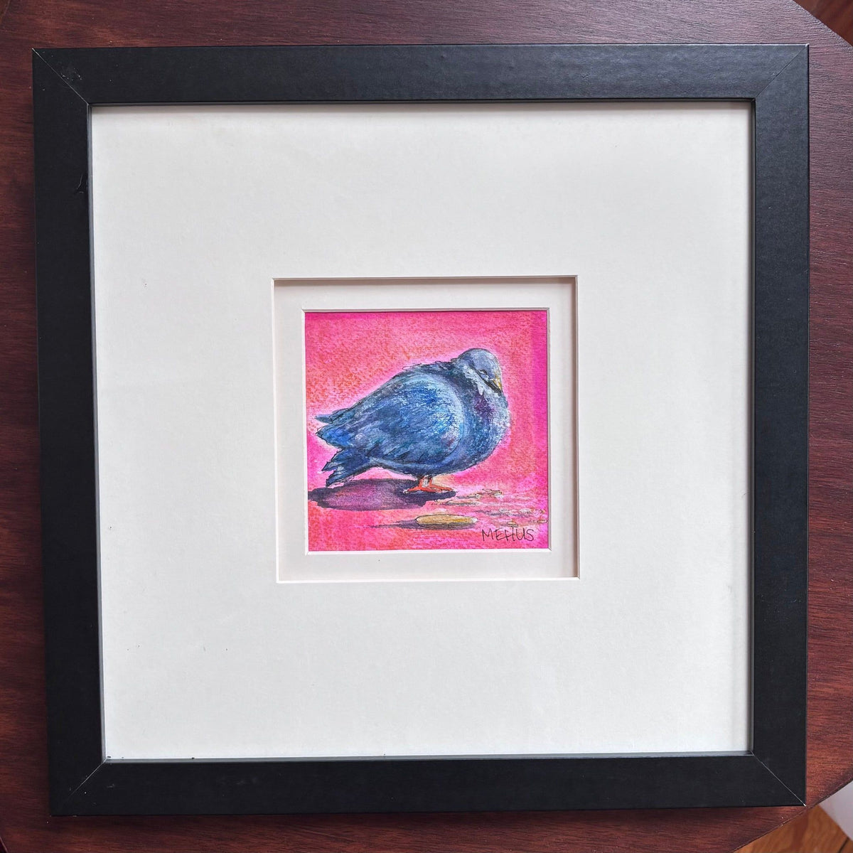 pigeon art print shown framed in a black frame with a white mat