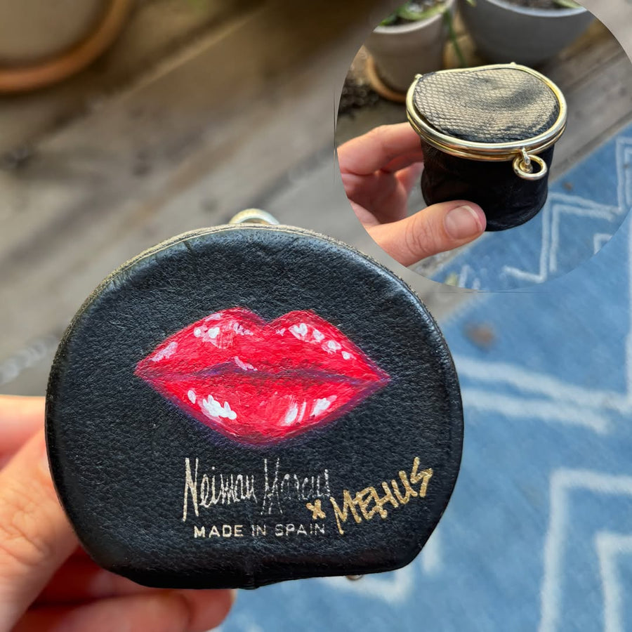 hand-painted red lips on a vintage black leather coin purse