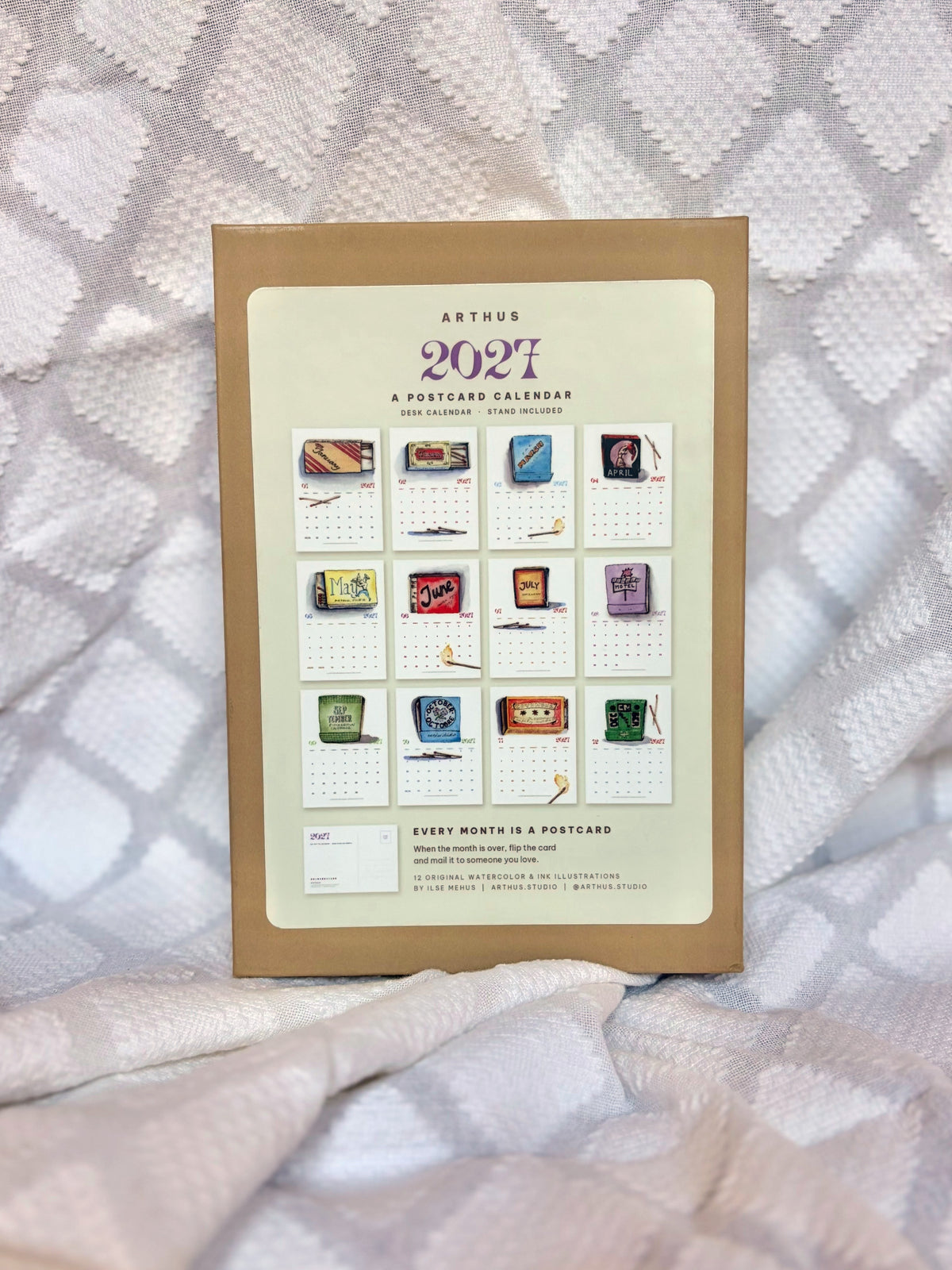 arthus 2027 postcard calendar box showing all 12 illustrated matchbook months