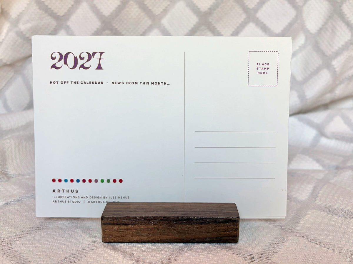 back of a 2027 calendar postcard, ready to mail, on walnut stand
