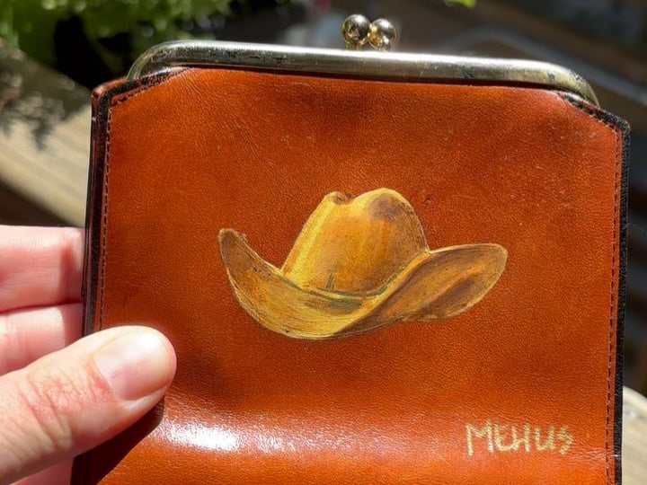 golden cowboy hat hand-painted on a vintage brown buxton leather kiss-lock wallet — another view