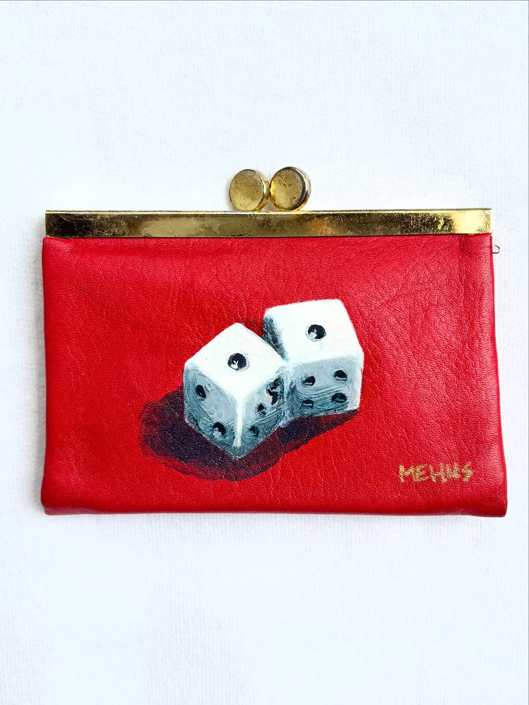 a pair of dice hand-painted on a vintage red buxton leather kiss-lock wallet