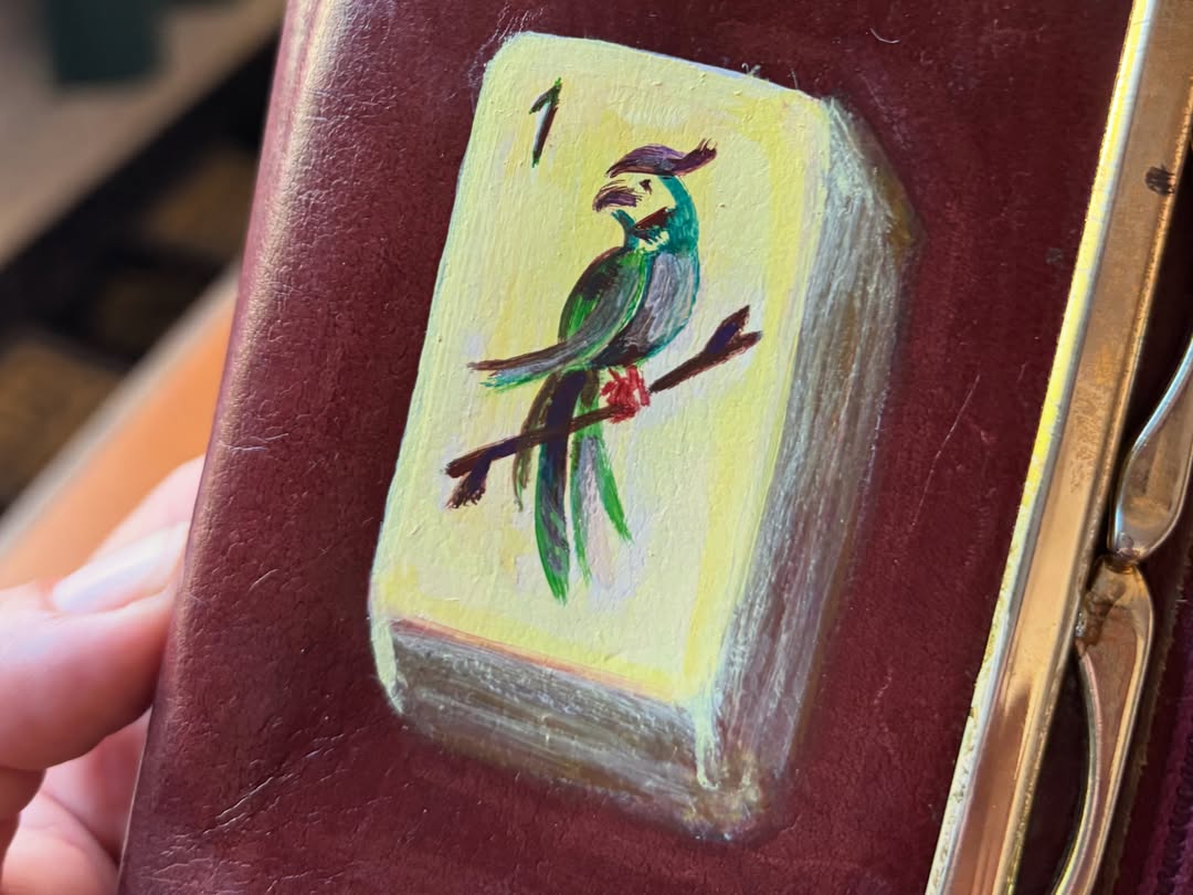 bamboo mahjong tile hand-painted on a vintage oxblood rolfs leather wallet — detail