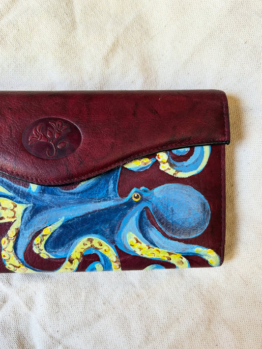octopus hand-painted on a vintage marbled burgundy buxton leather wallet, a custom commission