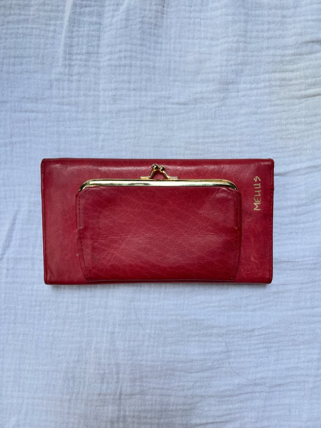 ravioli hand-painted on a vintage red buxton leather bifold wallet — detail