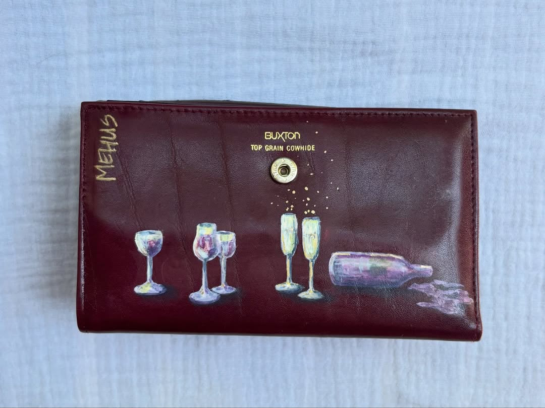 wine glasses, champagne flutes, and a bottle hand-painted on a vintage burgundy buxton leather clutch wallet — detail