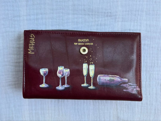 wine glasses, champagne flutes, and a bottle hand-painted on a vintage burgundy buxton leather clutch wallet — detail